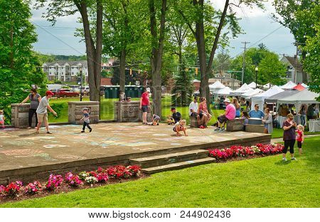 Twinsburg, Oh - June 9, 2018: Children Draw Chalk Art On A Concert Stage At A Taste Of Twinsburg, An