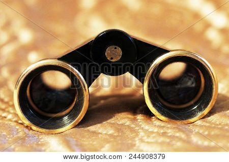 Close Up Of Vintage Opera Glasses, Golden Backgrtound