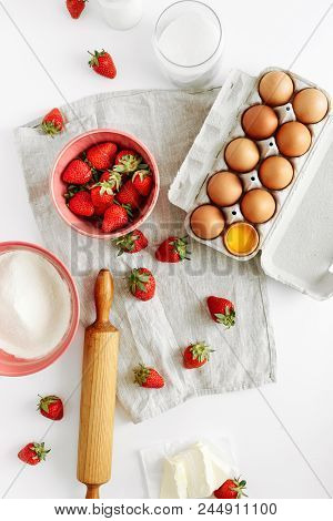 Set Ingredients For Cooking Strawberry Pie Or Cake On White Background. Flat Lay, Top View. Eggs, Fl