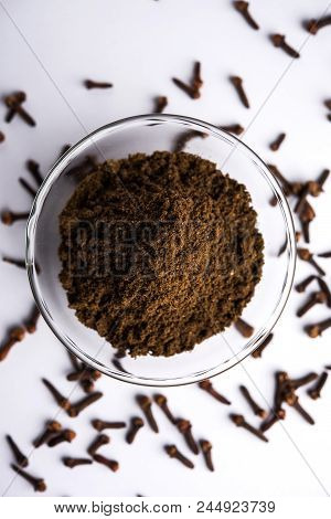 Whole Cloves Or Laung Or Lavang With Powder In A Bowl Isolated On White. Whole Cloves. Selective Foc