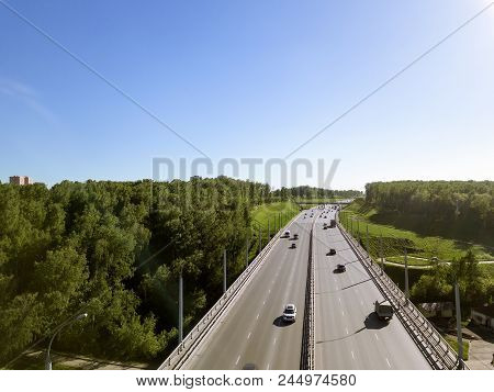 Aerial View Of The Largest Tiered Wide-arch Bridge And Green Trees In Russia. Bugrinsky Bridge In No