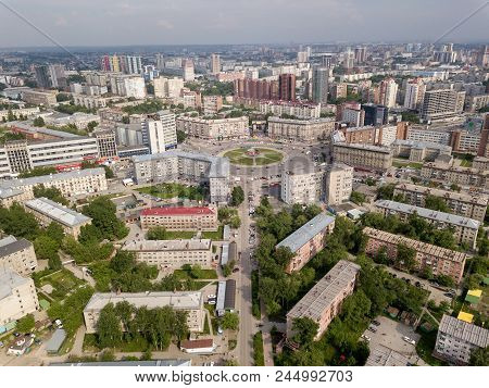 View from the air on old and new russian buildings near the circular motion in the city with a lot o