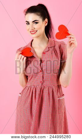 Attractive Girl Holding Two Red Hearts In Her Hands, Isolated On Pink Background. Love, Happy, Valen