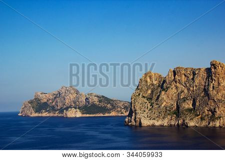 View Of Mountains With Beautiful Blue Sea Around At The Pointview In The City Of Cala Sant Vicent, M
