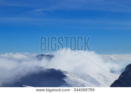 View On Demanovska Valley Covered With Heavy Clouds And Top Of Mountains Extend Like Islands On Sea.