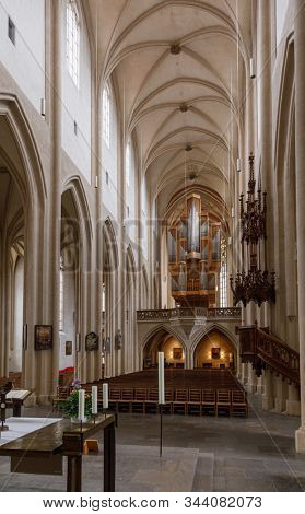 Rothenburg ob der Tauber, Germany - May 9, 2019: Interior of lutheran St. James (Jakob)'s Church, a part of the pilgrimage route to St. James Church in Santiago de Compostela, Spain