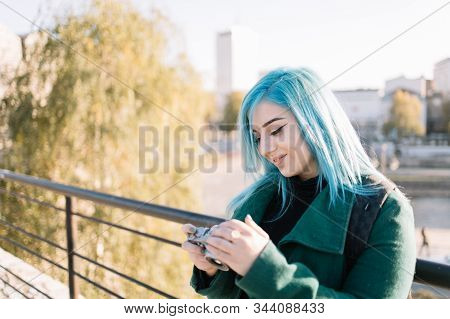 Girl With Blue Hair Checking Fotocameras Photos