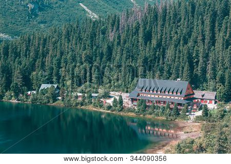 Large Wooden Hotel On The Lake In The Mountains