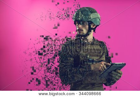 soldier using tablet computer hands closeup pnk background