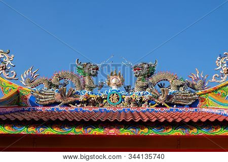 Two Chiness Dargons On Top Of Temple