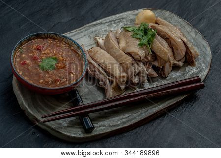 Asian Food Style Marinated Steamed Chicken (betong Chickken) And Sauce On Ceramic Plate. Serving Chi