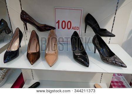 New Colorful Footwear With High Heel On Racks In Shopping Mall. Pointed Stilettos Display On Shop Fr