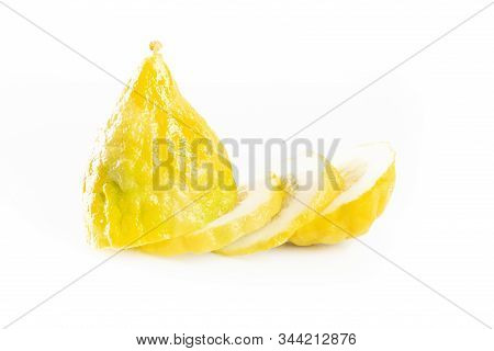 Ripe Citron Cut Into Slices Isolated On A White Background. Etrog - Symbol Of Jewish Sukkot Festival