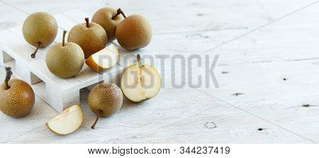 Nashi Pears (apple Pears Or Asian Pears) On A Wooden Table
