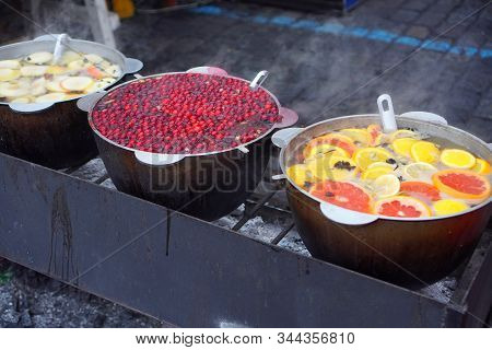 Mulled Wine Is Preparing In A Casserole Pots On The Street