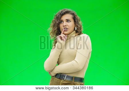 Young Woman Thinking Hard About A Decision, Looking Despaired.