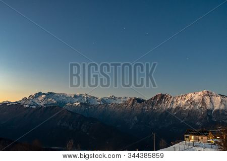Sunset In The Mountains Between Slovenia And Italy In A Freezing Winter Day