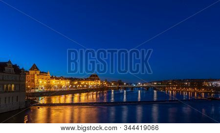 View Of River Moldau And National Theatre At Dawn In Prague.