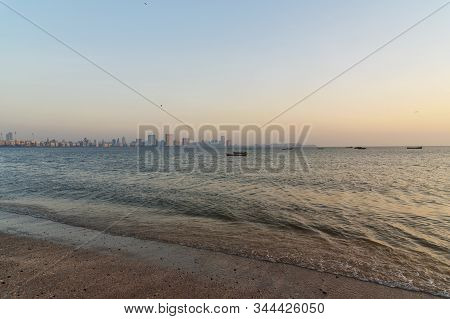 Sunset On Chowpatty Beach. View Of Malabar Hill In Mumbai. India