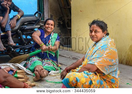 Mumbai, India - February 26, 2019: Indian Women Making Brooms In Dharavi Slum At Mumbai
