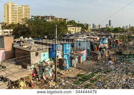 Mumbai, India - February 26, 2019: View Of Garbage Slums Poor Area Near Suburban Railway. Dharavi Sl