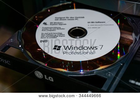 Wildflecken, Bavaria, Germany - January 11, 2020 An Original Microsoft Windows 7 Dvd In A Dvd Drive