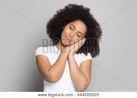 Tired African American Millennial Lady Put Head On Folded Hands.