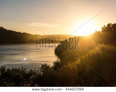 Sunset At The Mouth Of The Valdivia River, Near The City Of The Same Name, In The Region Of The Rive