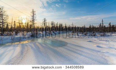 Winter Landscape With Frazil On A Frozen Stream In The Evening. South Yakutia, Russia.