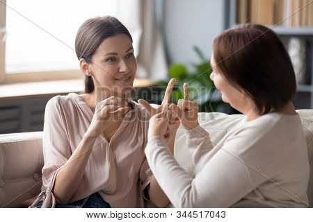 Deaf-mute Adult Mom And Daughter Talk Using Sign Language