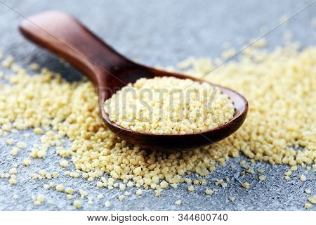 Couscous In A Wooden Spoon. Healthy Food