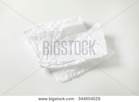 Creased sheet of white wax coated butcher paper