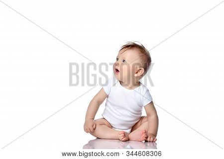Infant Child Baby Boy Kid With Blue Eyes Sitting In White Body T-shirt With Blank Copy Text Space Is