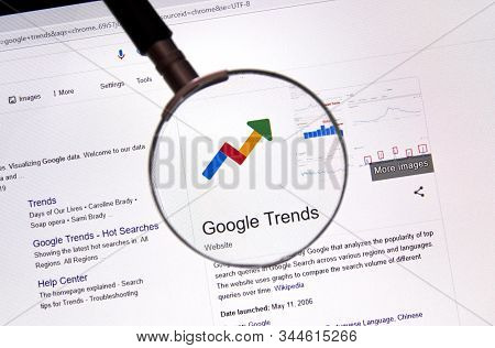 Montreal, Canada - July 14, 2019: Google Trends Web Site Under Magnifying Glass. Google Llc Is An Am