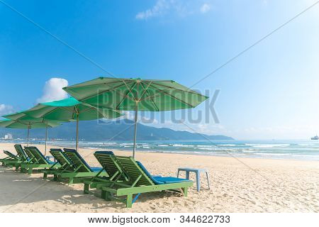 Beach Chairs With Outdoor Umbella At Summer Beach.