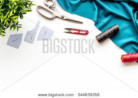 Sewing Wokrshop. Textile, Pattern, Scissors, Thread On White Background Top-down Copy Space