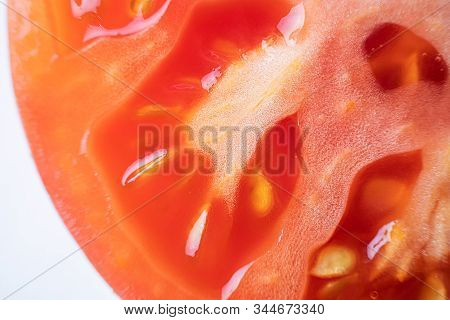 The Pulp Of A Tomato Close-up, Macro Photo. Organic Natural Food Concept. Fresh Ripe Tomato.