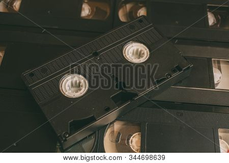 Stack Of Vhs Video Tapes As Background. Old Video Cassette
 Tapes. Retro Technology.