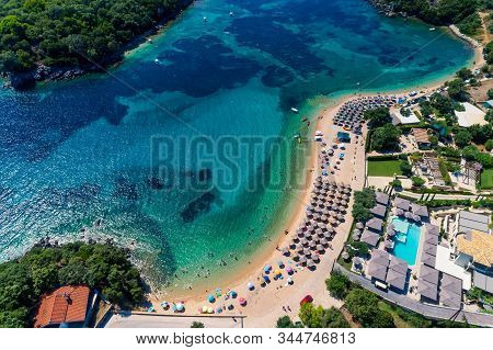 Aerial Drone Bird's Eye View Of Of Agia Paraskeui Beach With Turquoise Sea In Complex Islands In Par