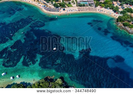 Aerial Drone Bird's Eye View Of Of Agia Paraskeui Beach With Turquoise Sea In Complex Islands In Par