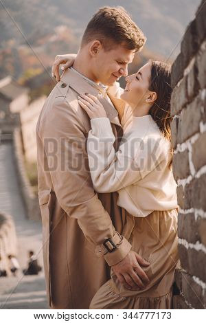 Beautiful Young Couple Hugging At The Great Wall Of China