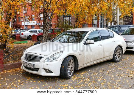 Ufa, Russia - October 10, 2019: White Luxury Car Infiniti G25 In The City Street.