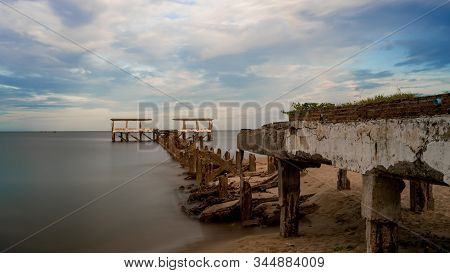 Dilapidated Old Fishing Dock Collapsing Into The Sea In Pak Nam Pran On The Gulf Of Thailand In Thai