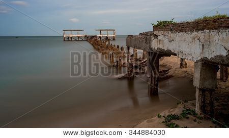 Dilapidated Old Fishing Dock Collapsing Into The Sea In Pak Nam Pran On The Gulf Of Thailand In Thai