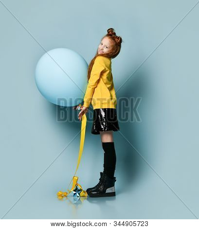 Ginger Teenage Girl With Fancy Hairstyle, In Yellow Sweatshirt, Black Skirt, Knee-highs And Boots. S