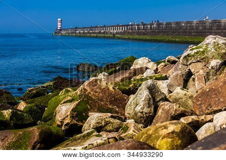 Porto, Portugal - May, 2018: People Enjoying A Sunny Early Spring Day At The Farolins Da Barra Do Do