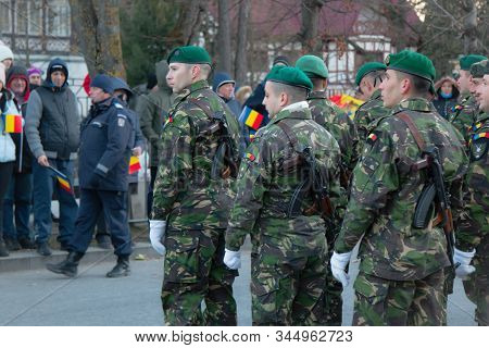 Army Platoon Dressed In Camouflage Uniform And Equipped With Machine Guns Similar To Ak47 At The Nat