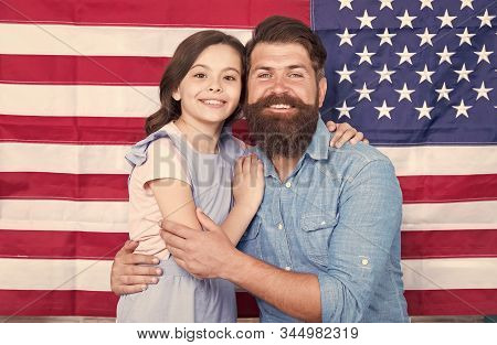 National Glory. Bearded Man And Little Child On National Flag Of The Usa. American Family Celebratin