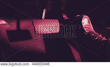 Close Up The Foot Pressing Foot Pedal Of A Car To Drive Ahead.