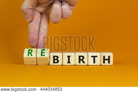 Birth Or Rebirth Symbol. Businessman Turns Wooden Cubes And Changes The Word Birth To Rebirth. Beaut